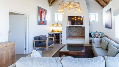 living room, indoor fireplace, bar are with two bar fridges, smart TV