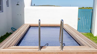 private swimming pool with automated pool cover